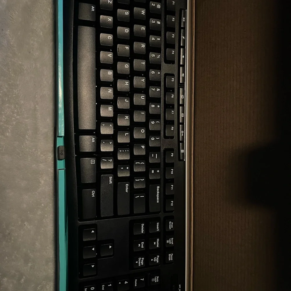Logitech Black Keyboard with Teal Packaging
